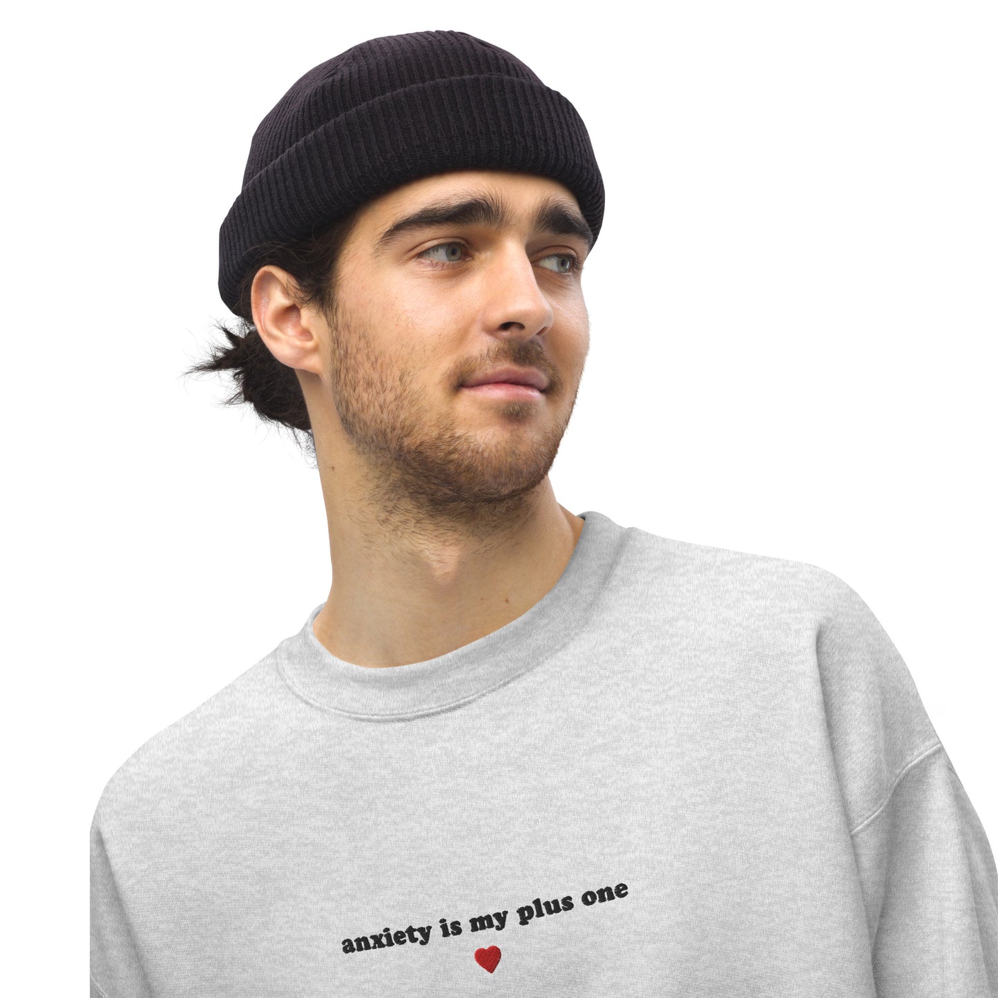 Grey embroidered unisex crewneck saying 'anxiety is my plus one' in black text with a heart, perfect for self-expression and mental health awareness.