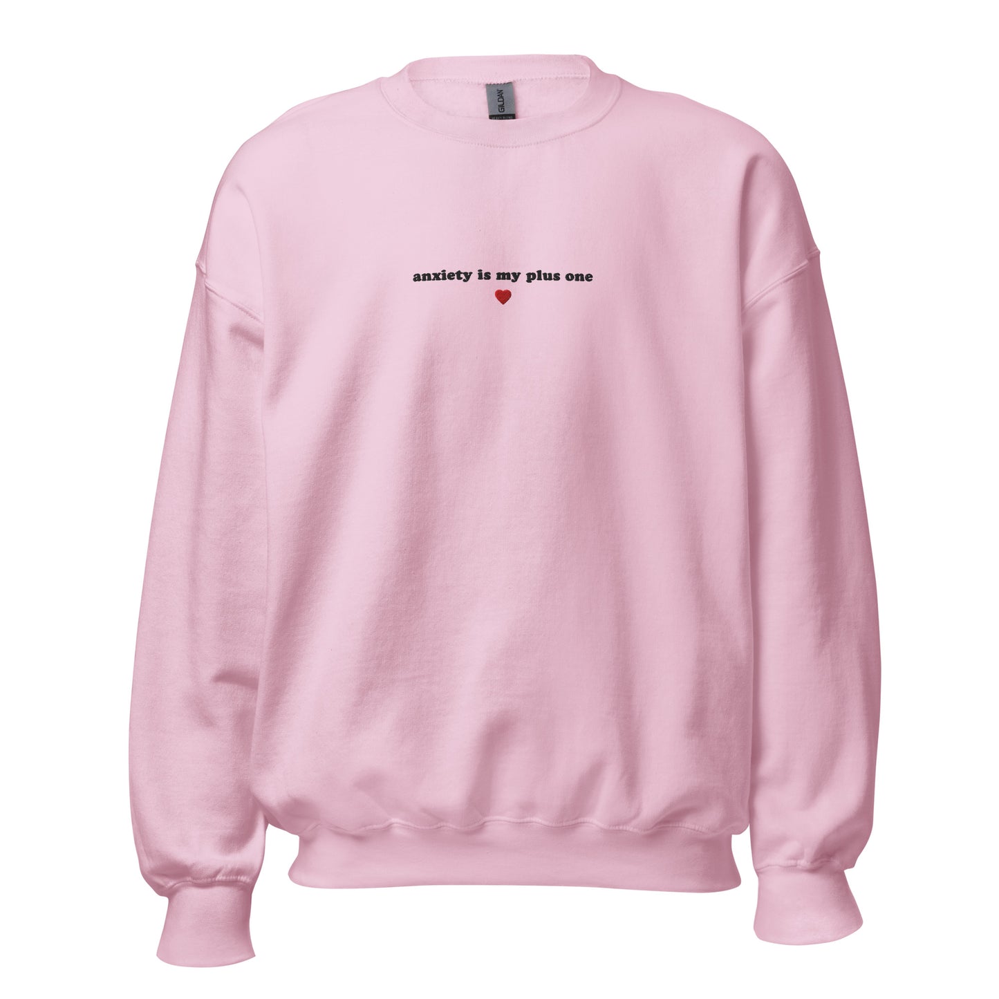 Pink unisex sweatshirt with embroidered 'anxiety is my plus one' design, perfect for mental health awareness and self-expression.