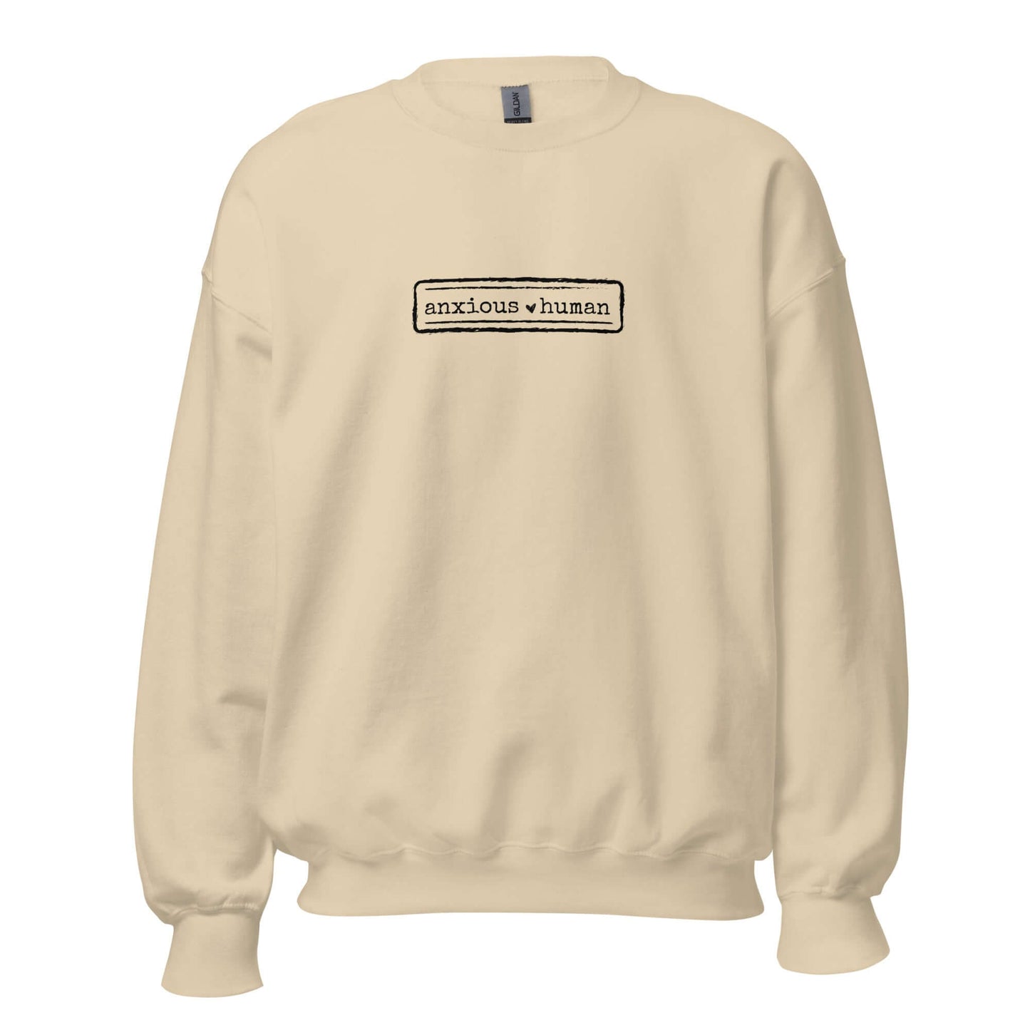 Beige (sand) unisex sweatshirt featuring 'anxious human' text, promoting mental health awareness and self-expression.