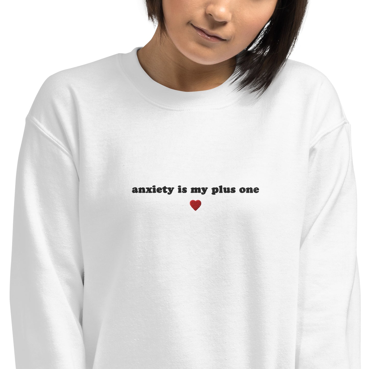 White embroidered unisex hoodie with 'anxiety is my plus one' text, perfect for mental health awareness and self-expression.