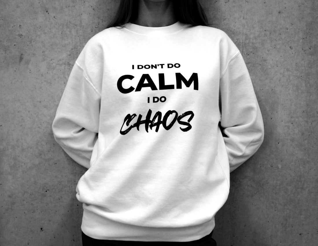 mental health and self awareness-inspired white sweatshirt saying: "I don't do calm, I do chaos"