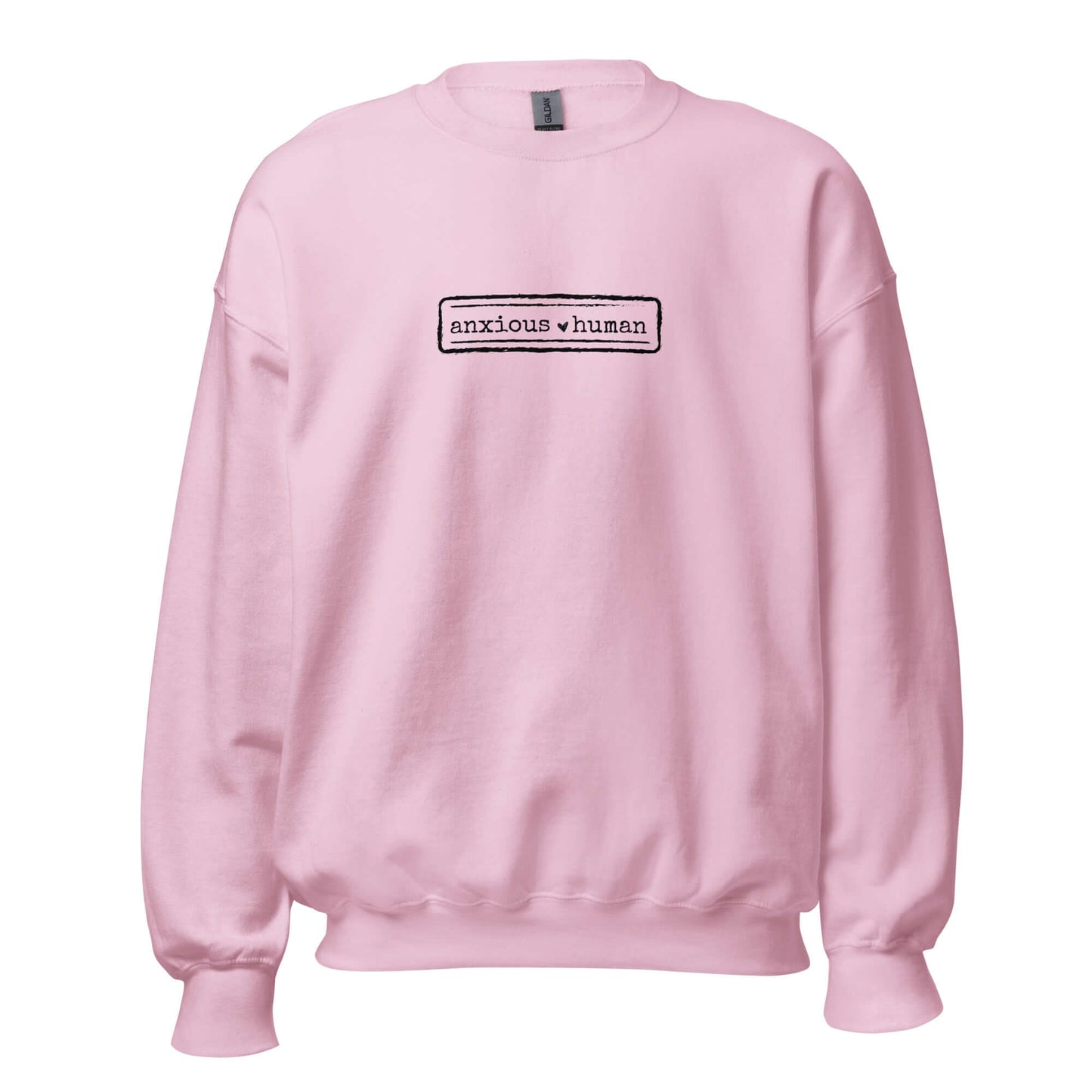 Light pink unisex sweatshirt featuring 'anxious human' text, promoting mental health awareness and self-expression.