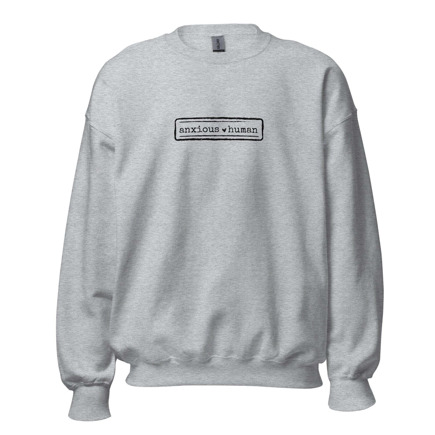 Sport grey unisex sweatshirt featuring 'anxious human' text, promoting mental health awareness and self-expression.