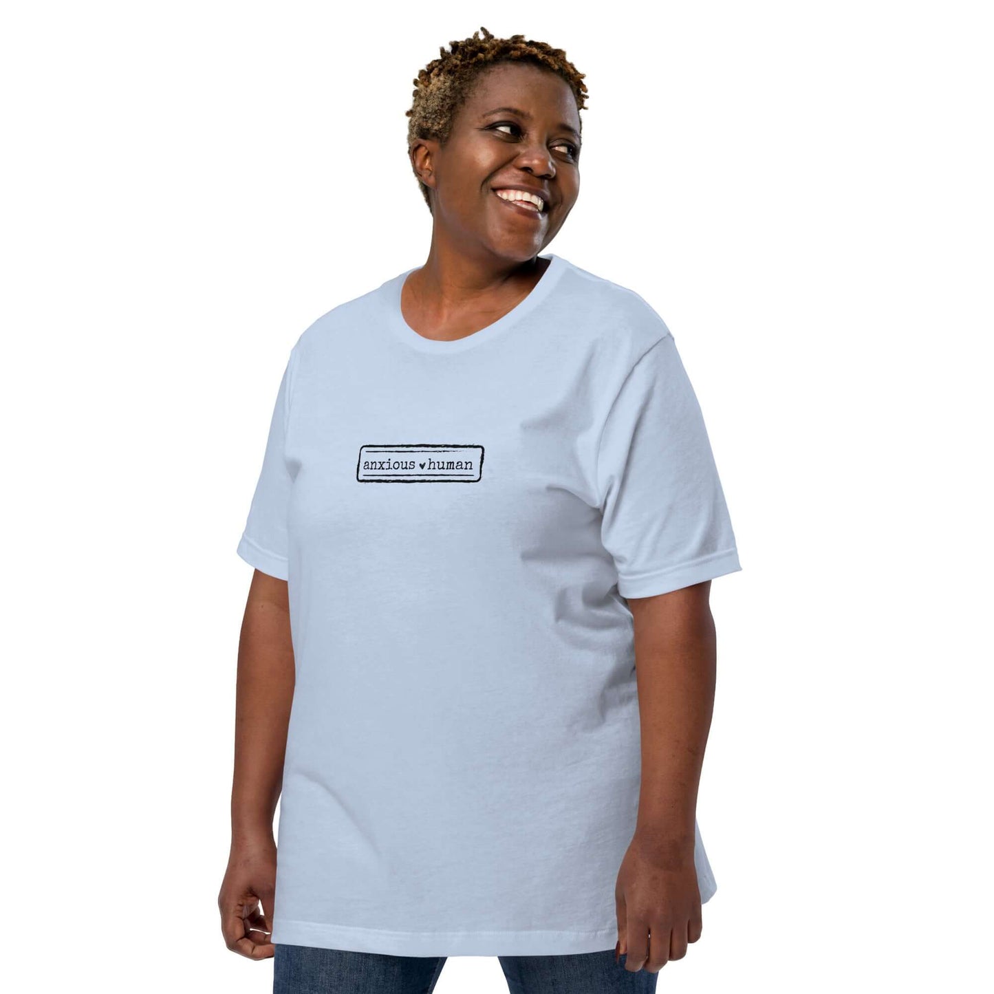Female model wearing unisex soft t-shirt in light blue, promoting mental health awareness and self-expression, perfect for gifting.