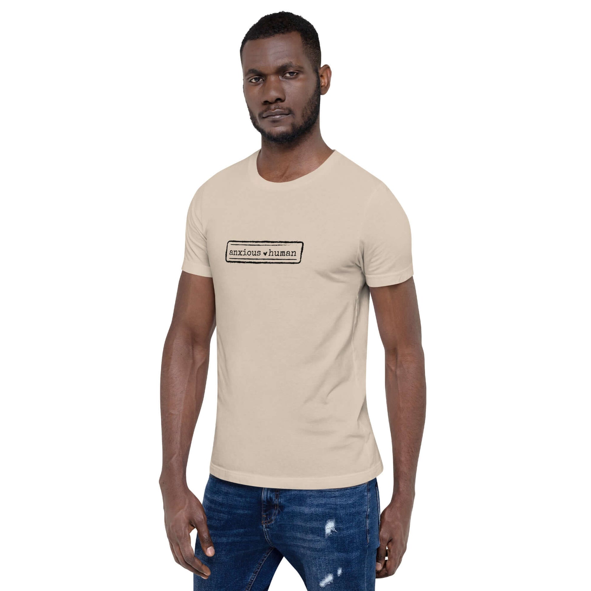 Male model wearing unisex soft t-shirt in beige, promoting mental health awareness and self-expression, perfect for gifting.